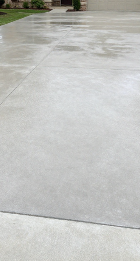 freshly poured wet concrete driveway